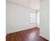 Bright bedroom featuring hardwood floors and a window with blinds at 1770 Lee St, Decatur, GA 30035