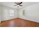 Spacious bedroom with hardwood floors and ceiling fan at 1770 Lee St, Decatur, GA 30035