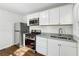 Modern kitchen with stainless steel appliances and white cabinets at 1770 Lee St, Decatur, GA 30035