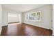 Sunlit living room with hardwood floors and large windows at 1770 Lee St, Decatur, GA 30035