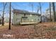 House back view with deck and wooded area at 2105 Cornerstone Sw Ln, Marietta, GA 30064