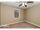 Bright bedroom with carpet flooring and ceiling fan at 2105 Cornerstone Sw Ln, Marietta, GA 30064