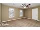 Well-lit bedroom with neutral walls and carpet at 2105 Cornerstone Sw Ln, Marietta, GA 30064