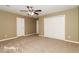 Spacious bedroom featuring a large closet and ceiling fan at 2105 Cornerstone Sw Ln, Marietta, GA 30064