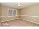 Simple bedroom with neutral walls and carpeting at 2105 Cornerstone Sw Ln, Marietta, GA 30064