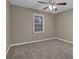 Well-lit bedroom with carpet and a ceiling fan at 2105 Cornerstone Sw Ln, Marietta, GA 30064