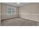 Spacious bedroom with neutral decor and carpet flooring at 2105 Cornerstone Sw Ln, Marietta, GA 30064