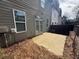 Enclosed backyard featuring a small concrete patio and a view of neighboring houses at 2113 Garden Pl, Atlanta, GA 30316