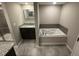 Bathroom showcasing a tub, stand-up shower, and granite-topped vanity at 2113 Garden Pl, Atlanta, GA 30316