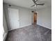 Bedroom with gray walls, ceiling fan, carpet, and a closet at 2113 Garden Pl, Atlanta, GA 30316