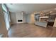 Open concept main floor with a view to the kitchen, fireplace, and hardwood floors at 2113 Garden Pl, Atlanta, GA 30316