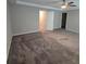 Spacious main bedroom featuring neutral walls, carpeted floor, and a ceiling fan at 2113 Garden Pl, Atlanta, GA 30316