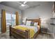 Spacious bedroom with a wooden bed frame and yellow blanket at 250 Pharr Ne Rd # 413, Atlanta, GA 30305