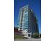 Exterior view of a modern high rise building on a clear day at 250 Pharr Ne Rd # 413, Atlanta, GA 30305