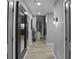 Modern apartment hallway with grey walls and wood-look flooring at 250 Pharr Ne Rd # 413, Atlanta, GA 30305