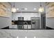 Modern kitchen with stainless steel appliances and marble countertops at 250 Pharr Ne Rd # 413, Atlanta, GA 30305