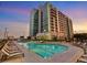 Luxury rooftop pool with plenty of lounge chairs at 250 Pharr Ne Rd # 413, Atlanta, GA 30305