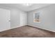 Well-lit bedroom with carpet and window at 280 Belmont Farms Dr, Ellenwood, GA 30294