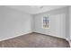 Bright bedroom featuring neutral walls and carpet at 280 Belmont Farms Dr, Ellenwood, GA 30294