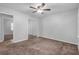 Spacious bedroom with mirrored closet doors and carpet at 280 Belmont Farms Dr, Ellenwood, GA 30294