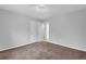 Well-lit bedroom with carpet and double doors at 280 Belmont Farms Dr, Ellenwood, GA 30294