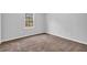 Simple bedroom with neutral walls and carpet at 280 Belmont Farms Dr, Ellenwood, GA 30294