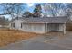 Front view of a ranch home with a carport at 280 Belmont Farms Dr, Ellenwood, GA 30294