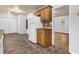 Kitchen with wood cabinets, tile flooring and view of living room at 280 Belmont Farms Dr, Ellenwood, GA 30294