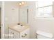 Clean bathroom with pedestal sink and toilet at 415 Gresham Dr, Stockbridge, GA 30281