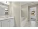 Bathroom with vanity, tub, and tiled flooring at 415 Gresham Dr, Stockbridge, GA 30281