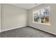 Bedroom with large window and carpet flooring at 415 Gresham Dr, Stockbridge, GA 30281