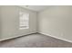 Bright bedroom with window and carpet flooring at 415 Gresham Dr, Stockbridge, GA 30281