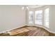 Sunlit dining area with large bay window and hardwood floors at 415 Gresham Dr, Stockbridge, GA 30281