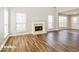 Bright living room with hardwood floors and a fireplace at 415 Gresham Dr, Stockbridge, GA 30281