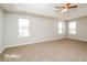 Large main bedroom with ceiling fan and carpet flooring at 415 Gresham Dr, Stockbridge, GA 30281