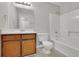 Clean bathroom with a shower/tub combo and wood vanity at 4179 White Rd, Snellville, GA 30039