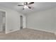 Bright bedroom with ceiling fan and neutral carpeting at 4179 White Rd, Snellville, GA 30039