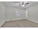 Bedroom with ceiling fan, window, and neutral walls at 4179 White Rd, Snellville, GA 30039