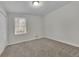 Bright bedroom with carpet flooring and double closets at 4179 White Rd, Snellville, GA 30039