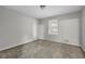 Well-lit bedroom featuring carpet and a window at 4179 White Rd, Snellville, GA 30039