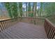 Wooden deck overlooking a wooded backyard at 4179 White Rd, Snellville, GA 30039