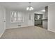 Dining area with grey walls and view into kitchen at 4179 White Rd, Snellville, GA 30039