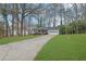 Front yard view of a single-story house with a long driveway at 4179 White Rd, Snellville, GA 30039