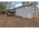 Rear view of house showing deck and backyard at 4179 White Rd, Snellville, GA 30039