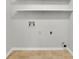 Laundry room with shelving and hookups for washer/dryer at 4179 White Rd, Snellville, GA 30039