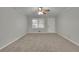 Bright living room featuring neutral walls and carpeted floor at 4179 White Rd, Snellville, GA 30039