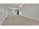 Spacious living room with neutral carpeting and ceiling fan at 4179 White Rd, Snellville, GA 30039