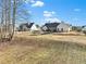 Expansive backyard with two homes visible and a large yard at 43 Harmony Woods Dr, Dallas, GA 30157