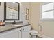 Modern bathroom with granite countertop, white cabinets, and updated fixtures at 43 Harmony Woods Dr, Dallas, GA 30157