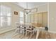 Dining room with farmhouse table, chandelier, and hardwood floors at 43 Harmony Woods Dr, Dallas, GA 30157